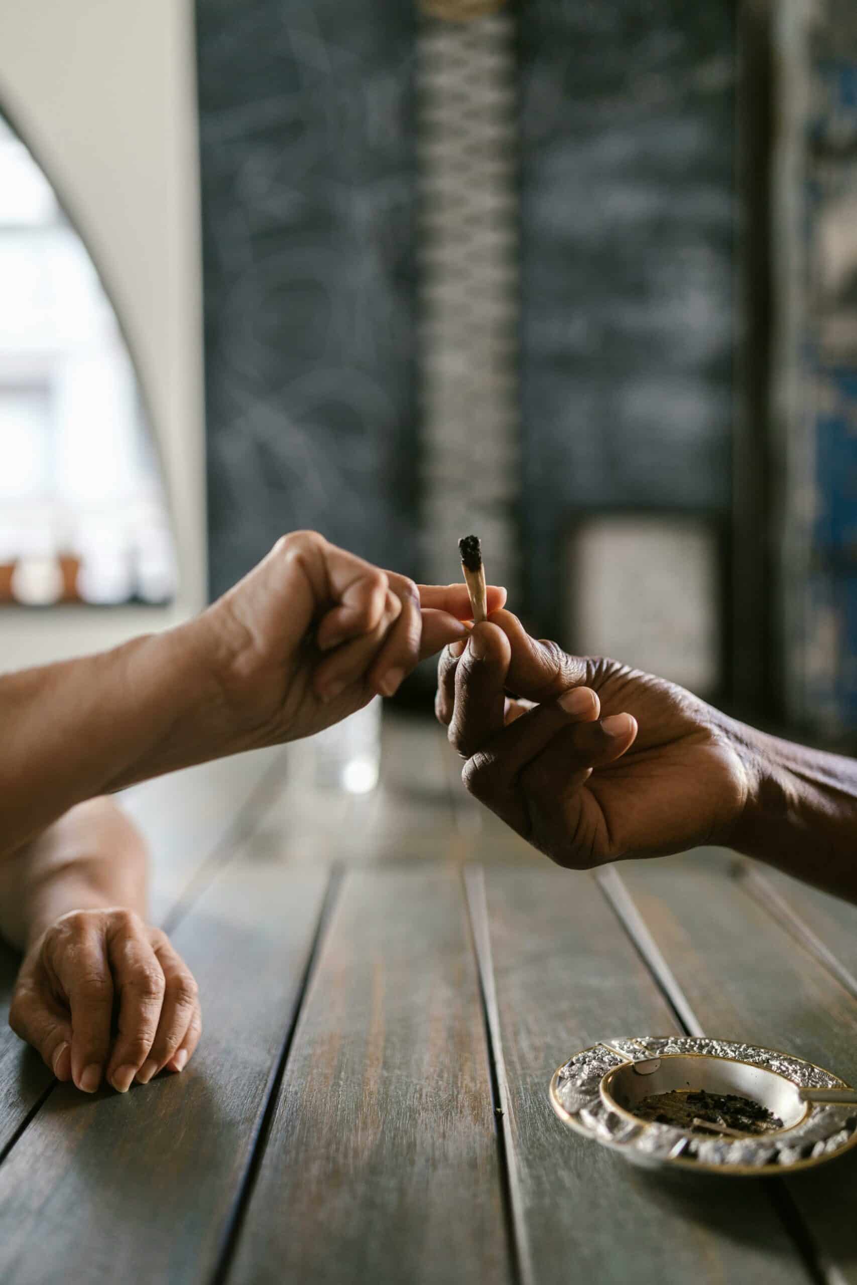 two people passing a joint