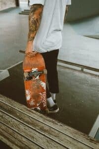 someone holding their skateboard